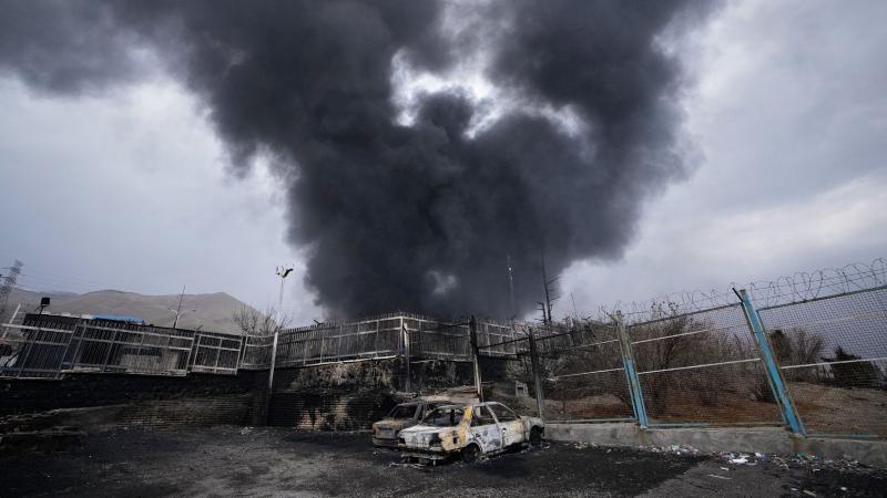 Black rain in Iran 2026 - toxic smoke rises over Tehran after oil depot strikes